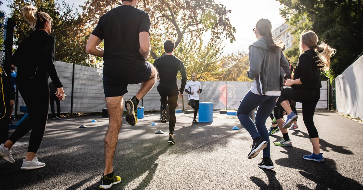 Photo of corporate people exercising outdoors